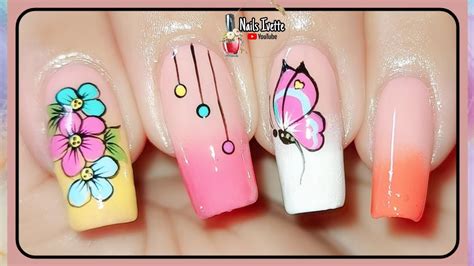 Uñas pintadas con flores y mariposa y unas inscrutaciones muy lindas ,los tonos verdes y blancos son una combinacion ganadora. Decoración de uñas flores y mariposa/uñas decoradas con ...