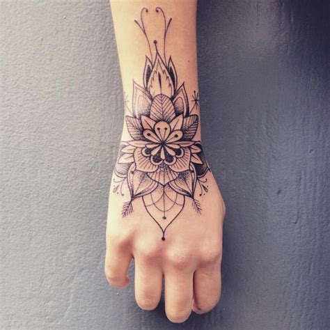 The size of this tattoo can be small or medium. female wrist tattoo - Reniox