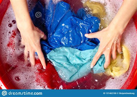 After the wash cycle is complete, remove. Women Washing Color Clothes In Basin Enemale Powdered ...