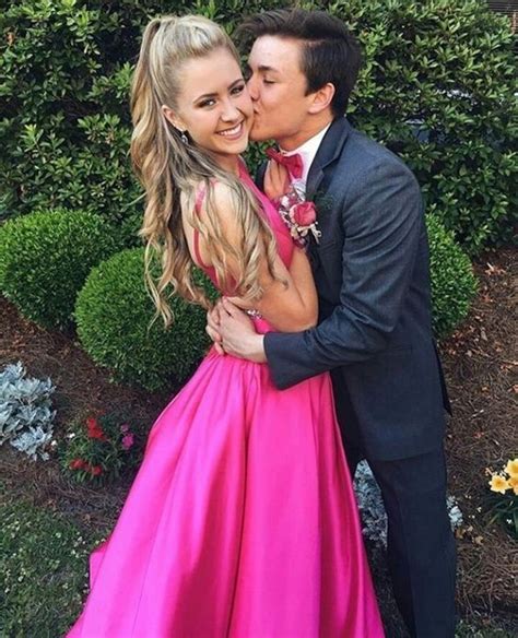 This couple color coordinated their wedding dresses perfectly! We LOVE this adorable couple sporting pink to the prom ...