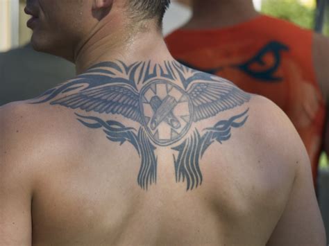 Depending on the size and intricacy of the design, a tattooist charges for a back tattoo. Wing Tattoos For Men Pictures On Upper Back