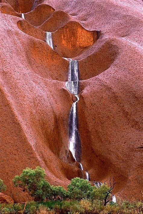 At 348 metres high, ulu r u is one of the world's largest monoliths, towering over the surrounding landscape and some 550 million years old. Uluru Waterfalls, Australia: - World Travel