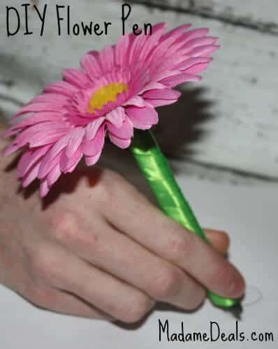 2.) then i pulled off the leaves, including the small plastic part at the bottom, and i put the leaves right under the flower. Save On Crafts: DIY Flower Pens - Real Advice Gal