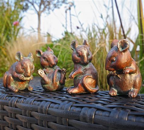 Field mice will attack trees and shrubs during the winter, using the wood as a food source. four little mice sculptures by london garden trading ...