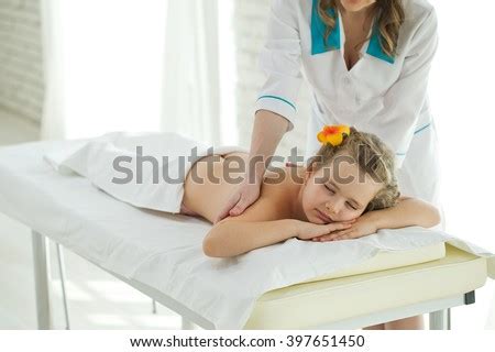 These places are a little more expensive than the smaller massage shops. Woman Does Massage Little Girl Stock Photo (Edit Now ...