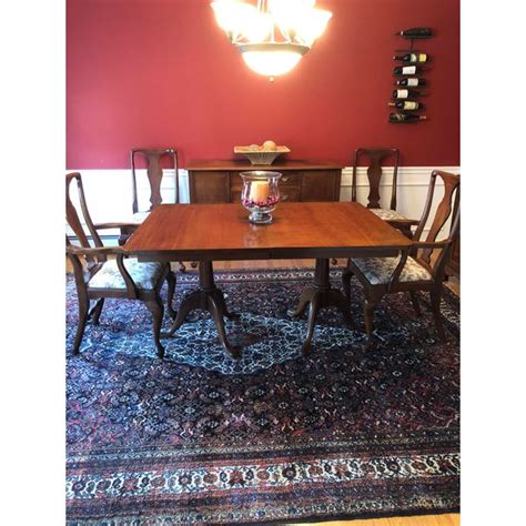 The only way to make that experience richer and more enjoyable is with a stunning dining room table. Craftique Solid Mahogany Dining Set | Chairish